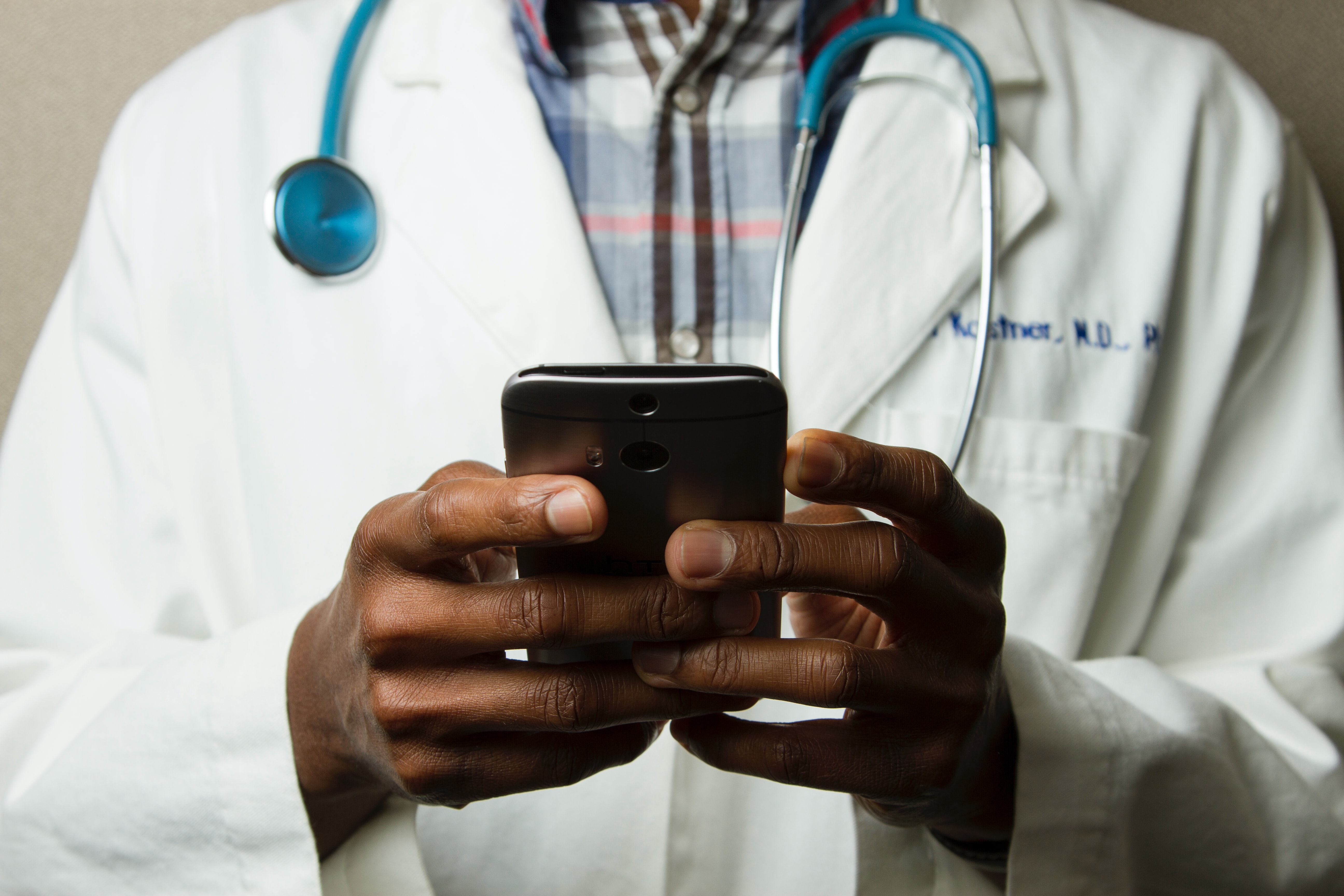 Doctor holding a mobile phone